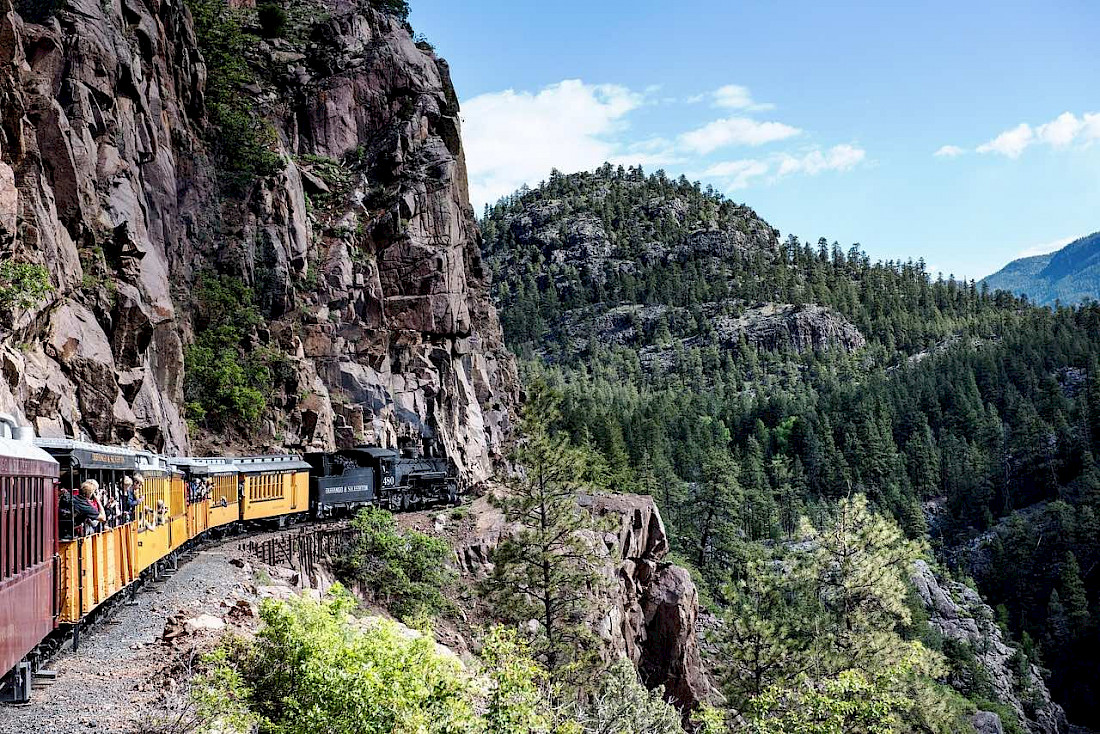Historic train rides are a great way to lay witness to endless mountain vistas.