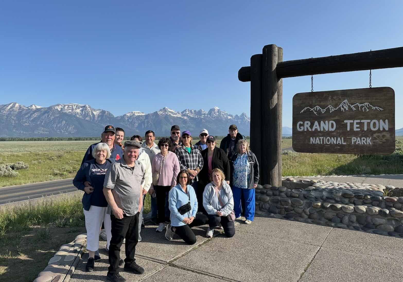 An epic group picture at the entrance to Grand Teton National Park.